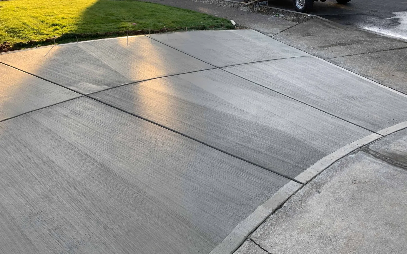 New broom finished driveway with saw cut control joints, concrete driveways