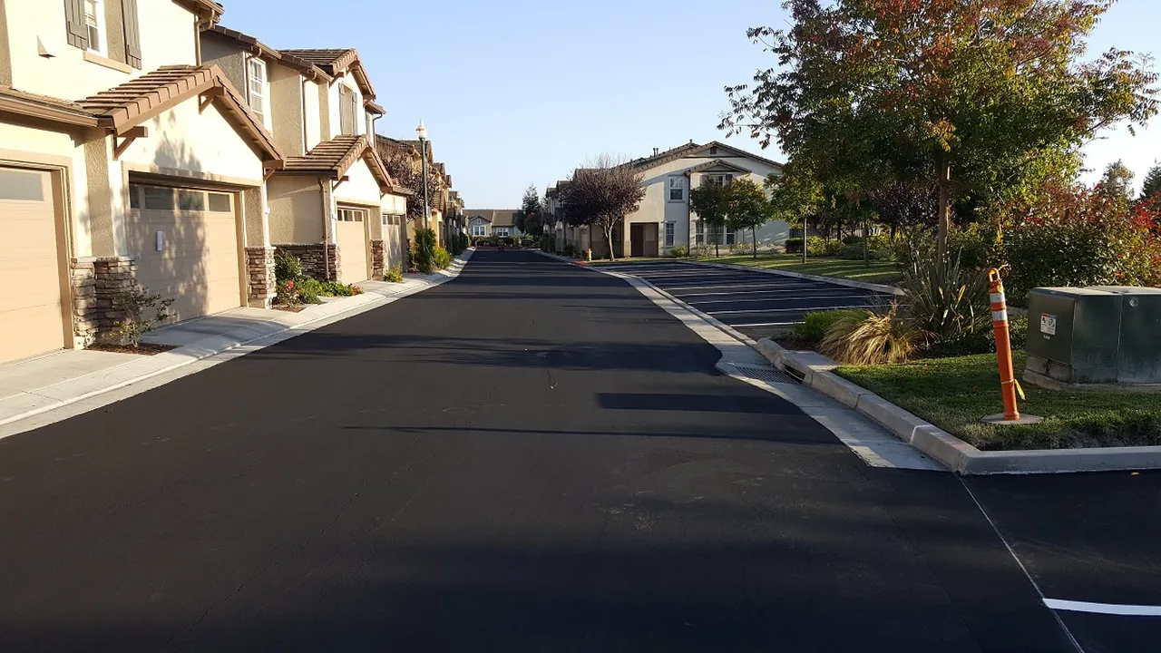 Freshly surfaced private street running between townhomes